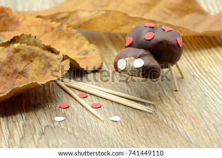 tinker small ladybug figure made of chestnut and teeth sticks.
