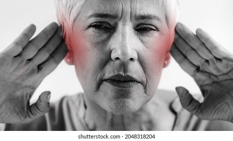 Tinnitus. Senior Woman Suffering From Tinnitus.