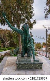 Tinos, Greece - May 2019: Statue of a facless woman crawling for a miracle in Tinos island, Cyclades, Greece