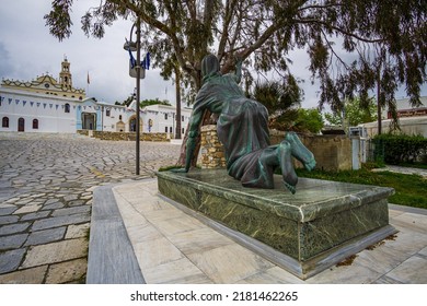 TINOS ISLAND, GREECE - MAY 2019: Statue of a facless woman crawling for a miracle in Tinos island, Cyclades, Greece
