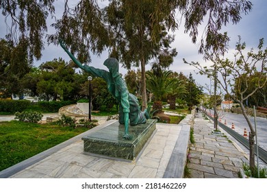 TINOS ISLAND, GREECE - MAY 2019: Statue of a facless woman crawling for a miracle in Tinos island, Cyclades, Greece