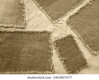 Tinted brown gray denim patchwork texture background
