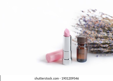 Tinted Nourishing Lavender Lipstick With Natural Care Ingredients And Essential Oil. Lavender Flowers On A White Background. Lip Care In Winter Time. Moisturising Balm Or Lipstick.