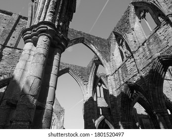 TINTERN, UK - CIRCA SEPTEMBER 2019: Tintern Abbey (Abaty Tyndyrn in Welsh) ruins in black and white - Shutterstock ID 1801520497