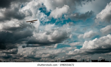 tiny airplane in the clouds 