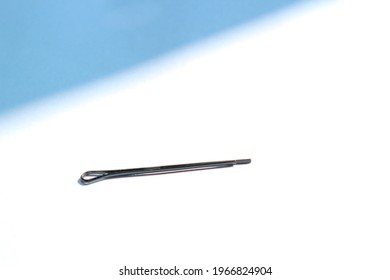 Tiny Black Hair Pin With White Background And Shadow