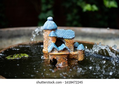 Tiny Castle Water Fountain In A Koi Pond