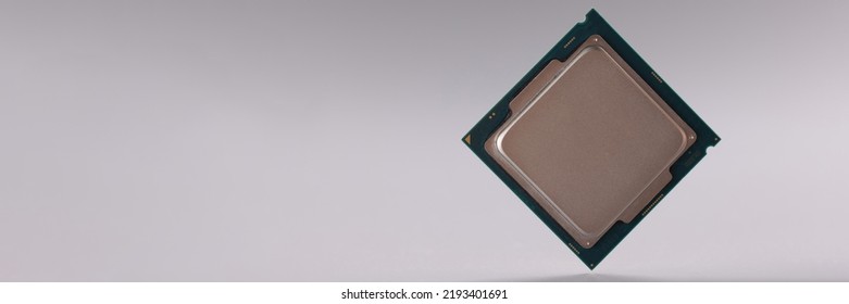 Tiny central processing unit, processor chip on grey background