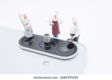 Tiny chef figurines work around a phone's camera module,