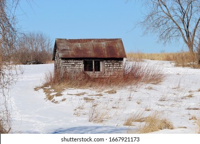 Tiny Chicken Coop In Middle Of Field In Winter 