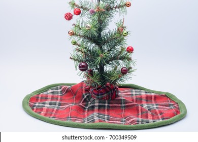 Tiny Christmas Tree With Tree Skirt And White Space