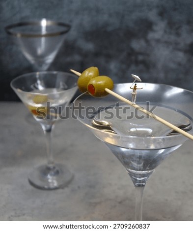 A Tiny Circus Performer walks across a Gin Martini Toothpick.