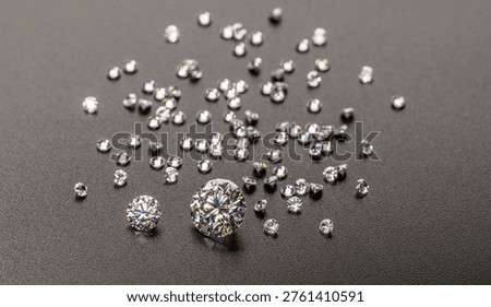 Tiny diamonds scattered on dark, textured surface