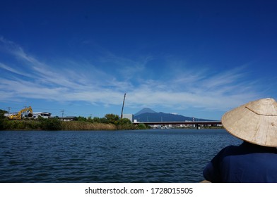 a tiny ferry boat on  a river