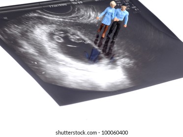 Tiny Figure Of Couple Walking On Early Pregnancy Ultrasound Image