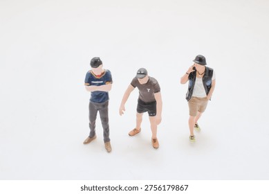 Tiny figurines pose in relaxed stances wearing sporty casual outfits