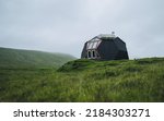 Tiny geometric igloo homes with grass roofs on the hills. Most original houses and eco friendly in the world. Tourist popular attraction destination in Faroe Islands