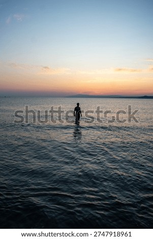 tiny guy among the waves