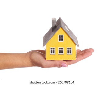 Tiny House In Female Hand Isolated On White