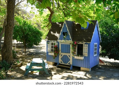 Tiny house in the garden for the kids to play - Powered by Shutterstock