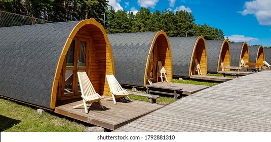 Tiny House Or Hotel Pod Made From Wood In Form Of Covered Wagon.