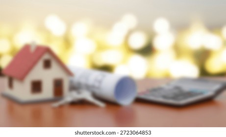 Tiny house model with blueprint, and keys  calculator planning dream home.