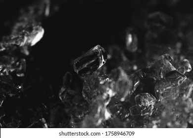 Tiny ice cubes closeup black and white