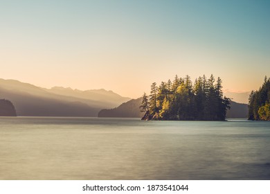 Tiny island in Harrison Lake. Long exposure of the lake during the sunset - Powered by Shutterstock