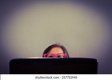 Tiny Little Person Behind A Large Computer Monitor