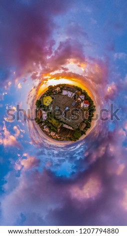 Tiny planet of a city during a sunset