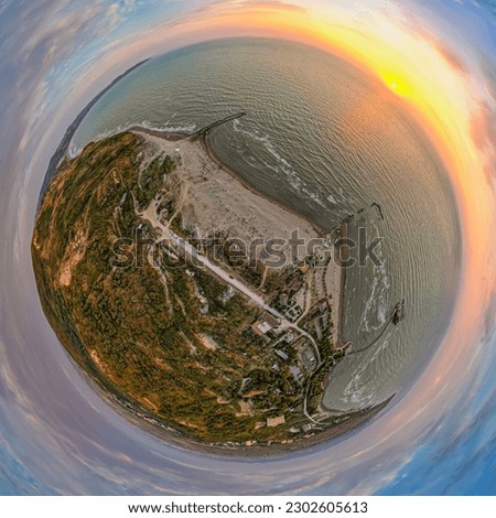 Tiny planet of coast in sunset above sea by village Karpen in Albania, Europe