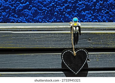 Tiny plastic Astronaut AND heart shape board. Love concept.  - Powered by Shutterstock - Get 15% off with code: PIKWIZARD15