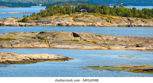 Tiny Red Granite Islands In Aland Islands Archipelago, Finland.