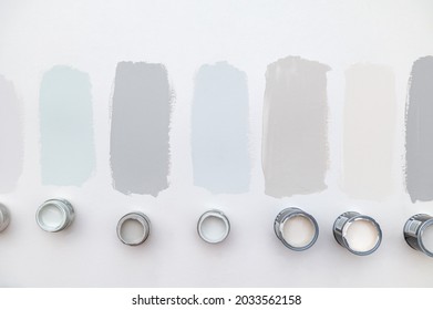 Tiny Sample Paint Cans During House Renovation, Process Of Choosing Paint For The Walls, Light Grey And Pastel Colors, Samples Of Paint On The Wall.