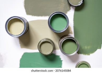 Tiny Sample Paint Cans During House Renovation, Process Of Choosing Paint For The Walls, Different Green Colors, Color Charts On Background