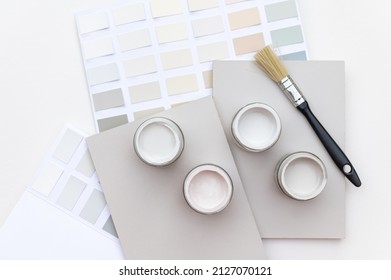 Tiny Sample Paint Cans During House Renovation, Process Of Choosing Paint For The Walls, Light Grey And Pastel Colors, Color Charts And Unit Samples On Background