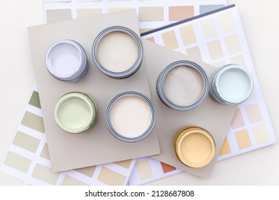 Tiny Sample Paint Cans During House Renovation, Process Of Choosing Paint For The Walls, Light Grey And Pastel Colors, Color Charts And Unit Samples On Background