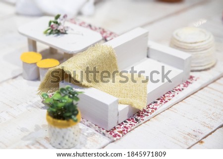 tiny sofa in a tiny room with accessories