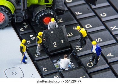 Tiny toys team of engineers repairing keyboard computer laptop.Computer equipment.Computer repair concept - Powered by Shutterstock