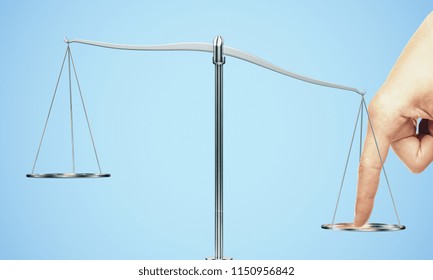 Tip The Scales Of Justice Concept. Finger Illegaly Influencing The Legal System For An Unfair Advantage On Blue Backdrop.