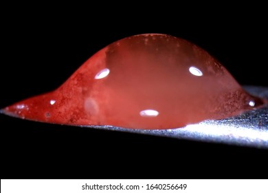 Tip Of A Syringe Needle With Blood. Medical Syringe.