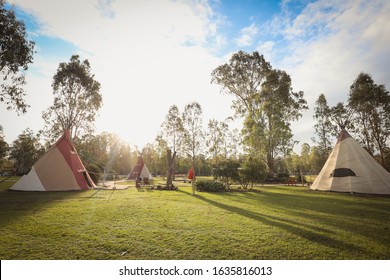 Tipi Camp Ground During The Day Under Cloudy Blue Sky