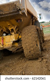 Tipper Truck With A Muddy Rear Wheel