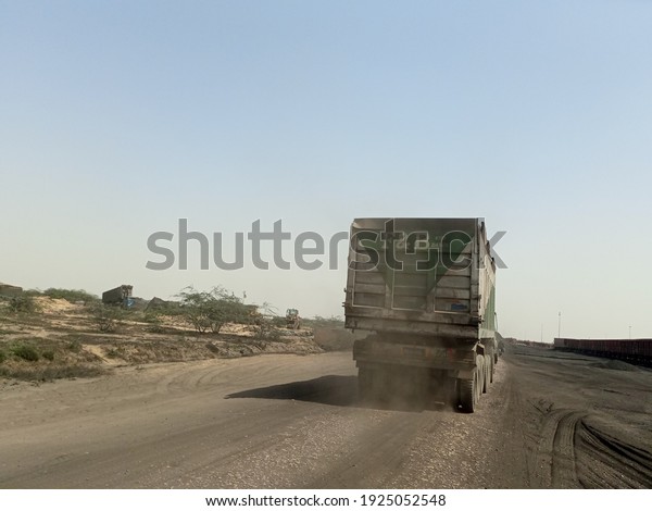 A tipper truck passing on a road  - Karachi Pakistan\
- Feb 2021