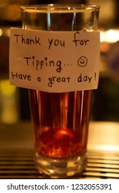 Tipping glass with note