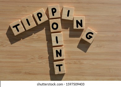 Tipping Point In Wooden Alphabet Letters On A Bamboo Wood Background