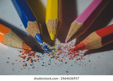 Tips of five colored pencils arranged in a circular pattern - Powered by Shutterstock