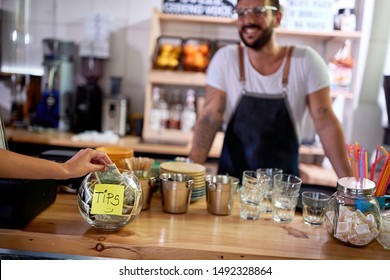 Tips Jar - Money Left For A Employee In Coffee Shop.
