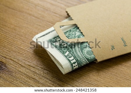 Tips for services in a small envelope on the table.