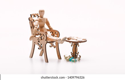 Tips tackling complex medication regimen. Take medicines after food. Medication regimen. Health care and medical treatment. Pills on tiny wooden table. Human wooden dummy near table with medicines. - Shutterstock ID 1409796326